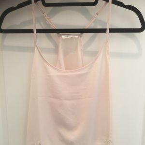 Sheer racerback cami with lace trim in light pink